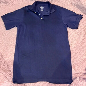 Men’s size small dark blue polo. Made by real essentials. Never worn. Like new!